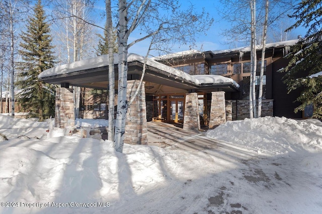 view of snow covered property