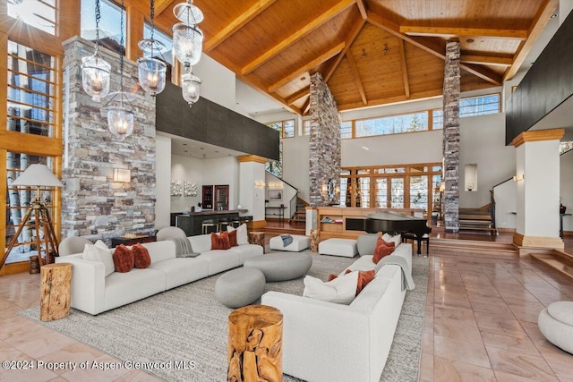 tiled living room featuring beamed ceiling, high vaulted ceiling, and wood ceiling