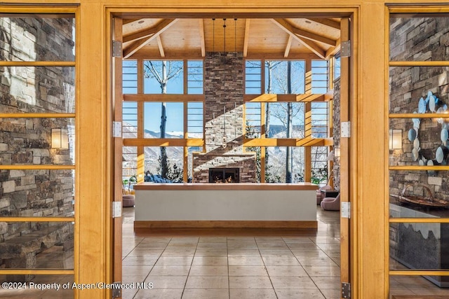 interior space featuring a large fireplace and wooden ceiling