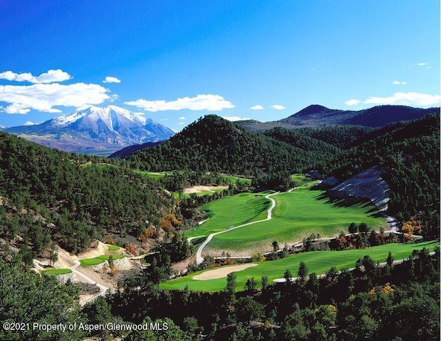 surrounding community with a mountain view