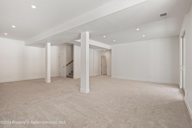 basement with light colored carpet