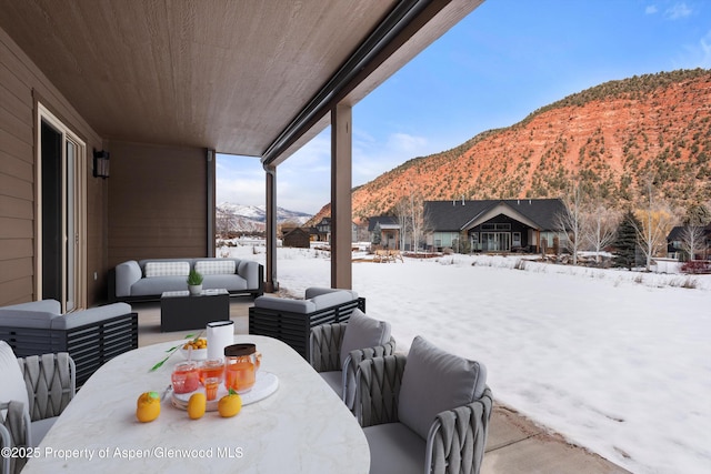 exterior space featuring an outdoor living space and a mountain view