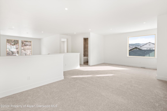 empty room featuring light colored carpet