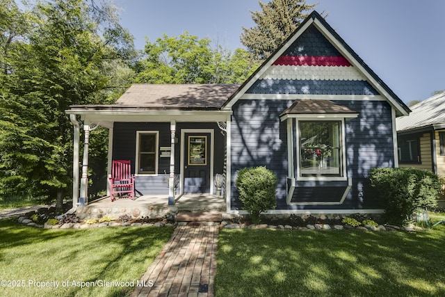 1131 Grand Ave, Glenwood Springs, CO 81601 - victorian house with covered porch and a front yard