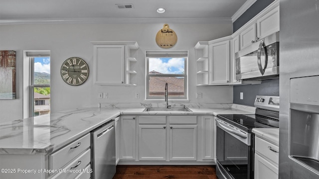 277 Castle Ridge Dr, New Castle, CO 81647 - kitchen featuring stainless steel appliances, open shelves, a sink, crown molding, and white cabinets