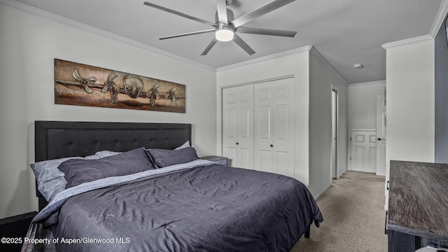277 Castle Ridge Dr, New Castle, CO 81647 - bedroom with carpet flooring, ornamental molding, a closet, baseboards, and a ceiling fan