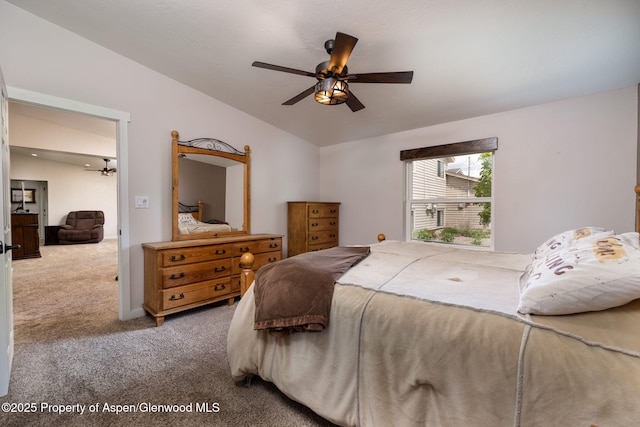 bedroom featuring carpet, lofted ceiling, and ceiling fan