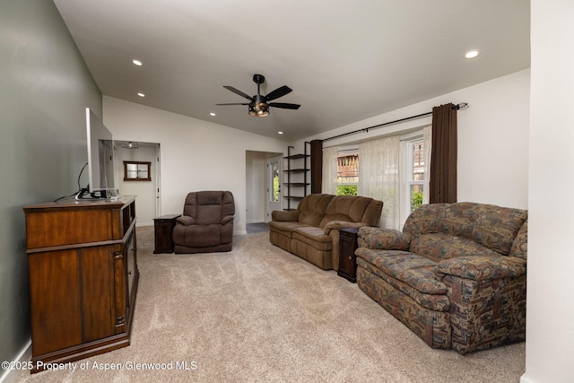 living room with lofted ceiling, light carpet, a ceiling fan, recessed lighting, and baseboards