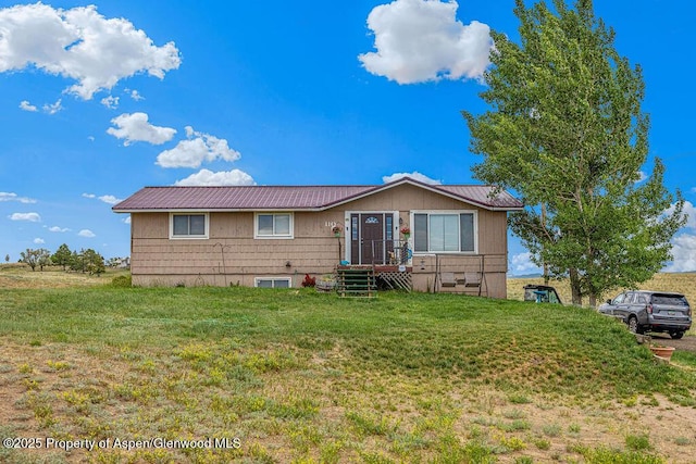 110 Western Ave, Craig, CO 81625 - ranch-style house with a front lawn and a metal roof