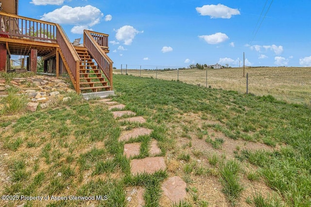 110 Western Ave, Craig, CO 81625 - view of yard featuring stairs, a wooden deck, and a rural view