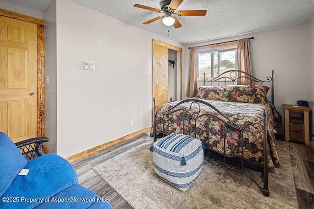 110 Western Ave, Craig, CO 81625 - bedroom with a textured ceiling, wood finished floors, and ceiling fan
