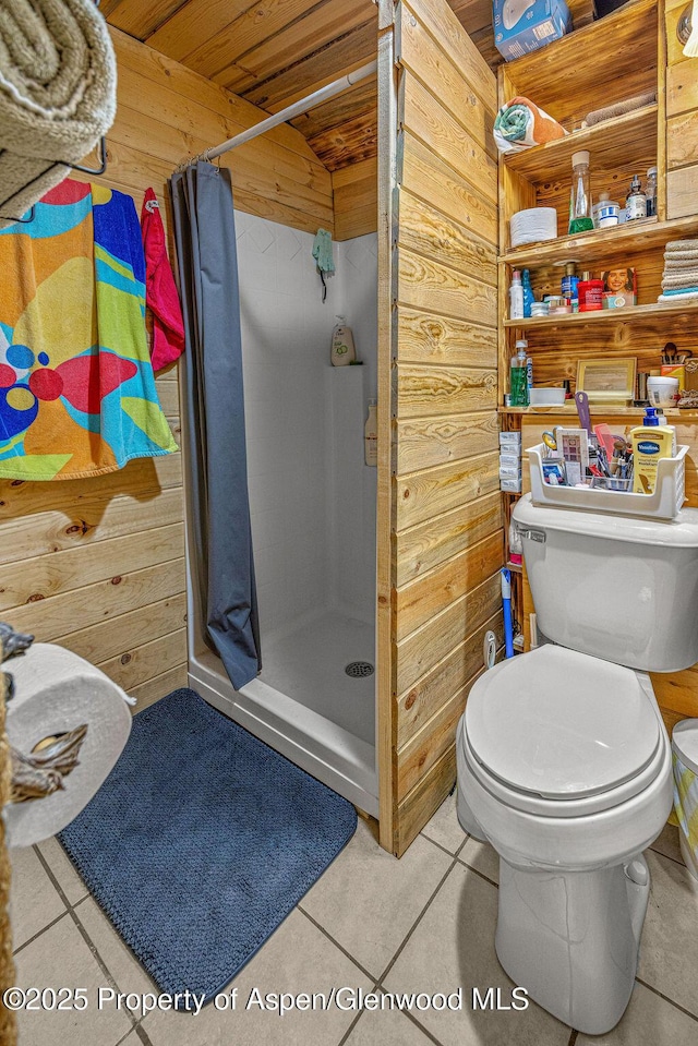 110 Western Ave, Craig, CO 81625 - full bathroom with tile patterned flooring, a stall shower, wooden walls, and wooden ceiling