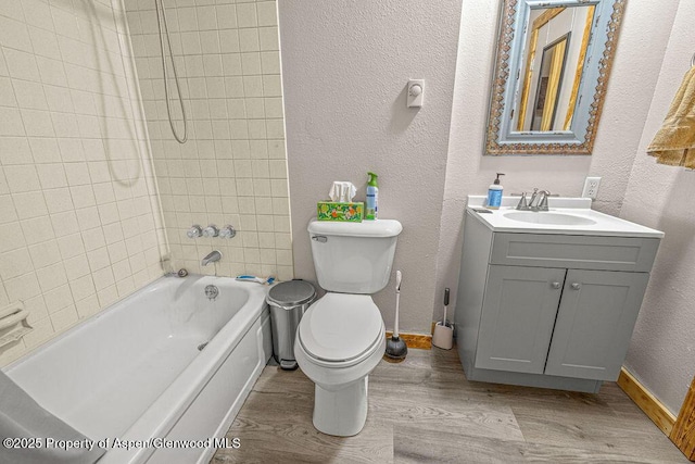 110 Western Ave, Craig, CO 81625 - bathroom with wood finished floors, a textured wall, vanity, and tub / shower combination
