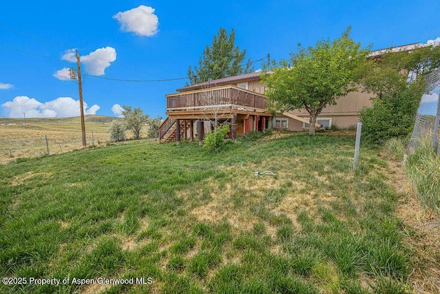110 Western Ave, Craig, CO 81625 - view of green lawn with stairway and a deck