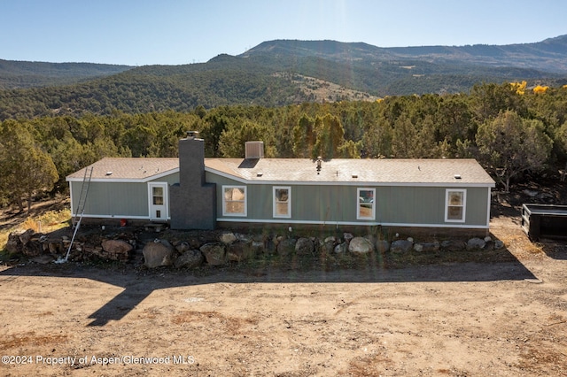 view of front of home with a mountain view