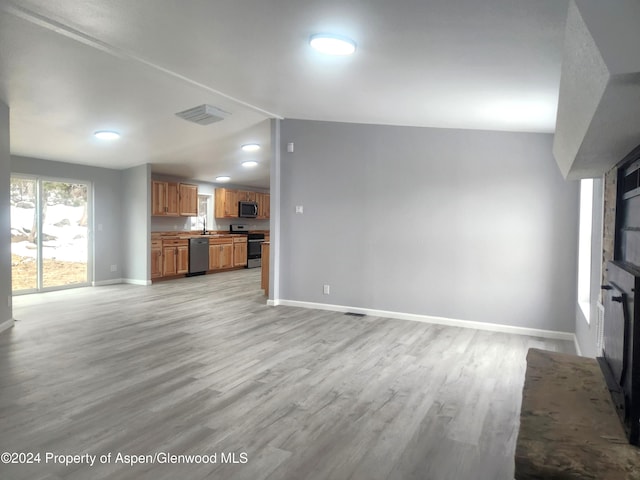 unfurnished living room with light hardwood / wood-style floors