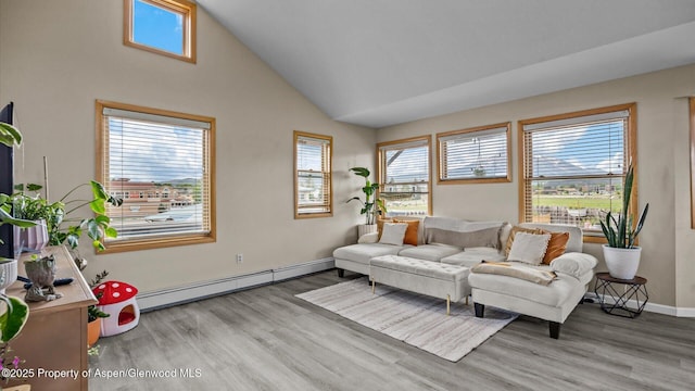 1000 Dolores Way Unit C, Carbondale, CO 81623 - sitting room featuring a baseboard heating unit, light wood finished floors, baseboards, and high vaulted ceiling
