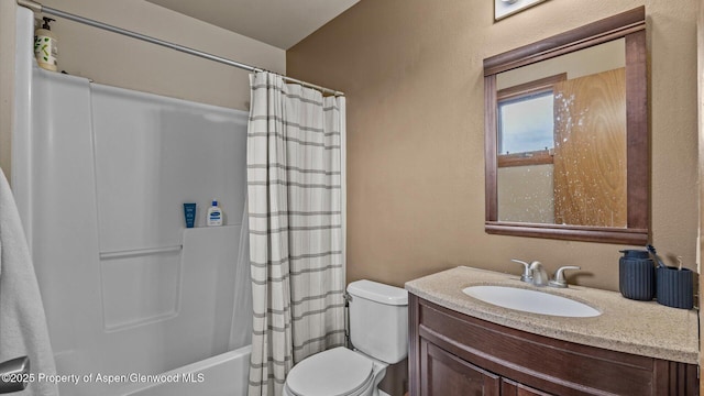 1000 Dolores Way Unit C, Carbondale, CO 81623 - full bathroom with vanity, toilet, shower / bath combo with shower curtain, and a textured wall