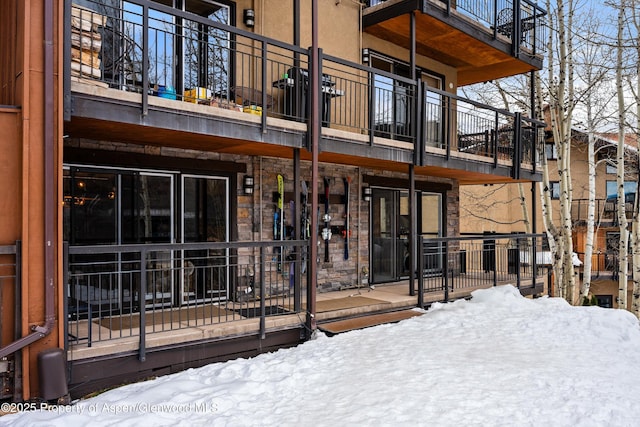 400 Wood Rd Unit 1118, Snowmass Village, CO 81615 - snow covered property with stone siding
