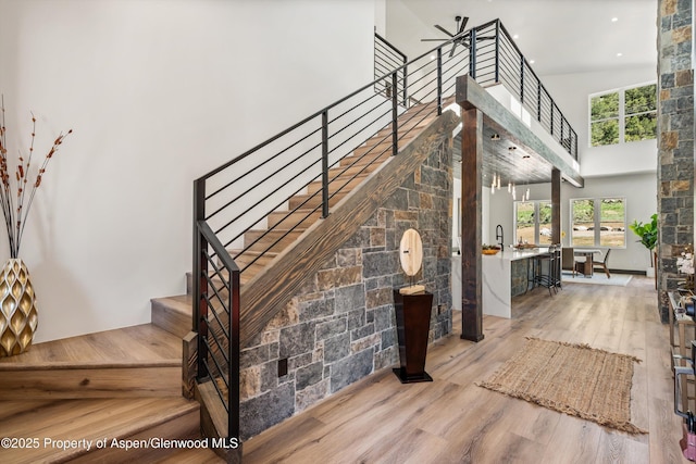 129 Sage Meadow Rd, Glenwood Springs, CO 81601 - stairway with recessed lighting, a towering ceiling, and wood finished floors