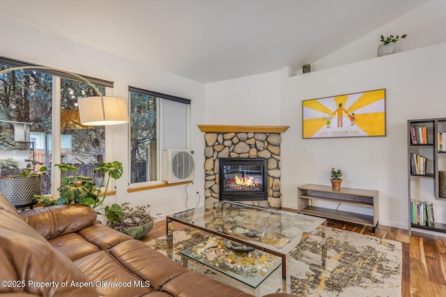 168 Current Dr, New Castle, CO 81647 - living room featuring vaulted ceiling, a fireplace, and wood finished floors