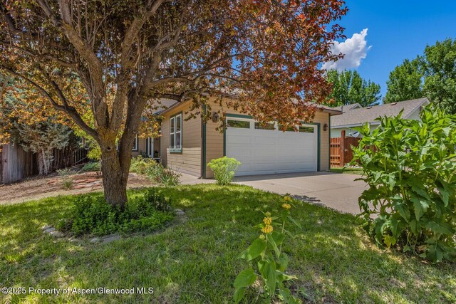 168 Current Dr, New Castle, CO 81647 - obstructed view of property with concrete driveway and an attached garage