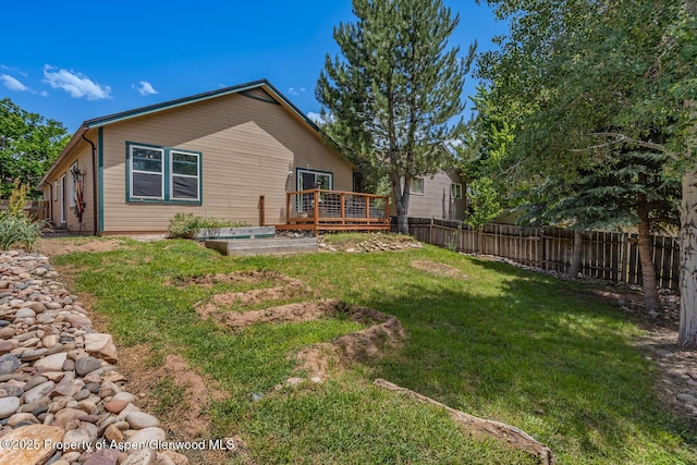 168 Current Dr, New Castle, CO 81647 - back of house featuring a fenced backyard and a deck