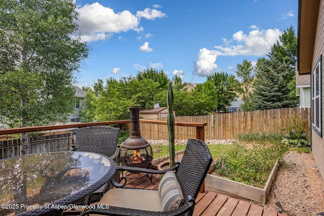 168 Current Dr, New Castle, CO 81647 - wooden terrace featuring a garden and outdoor dining area