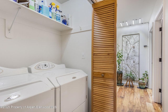 168 Current Dr, New Castle, CO 81647 - laundry room with washing machine and dryer and light wood-style floors