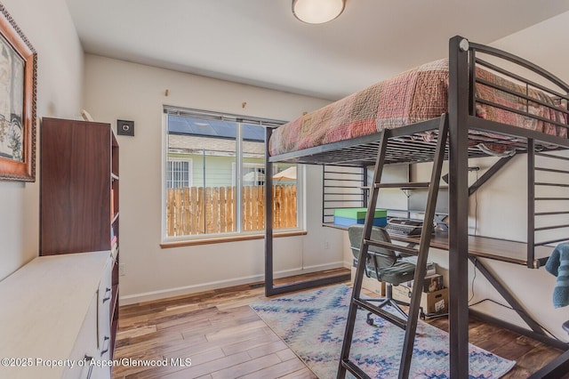 168 Current Dr, New Castle, CO 81647 - bedroom with light wood-type flooring and an office area
