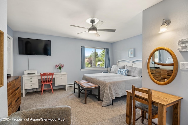 bedroom with ceiling fan and light carpet