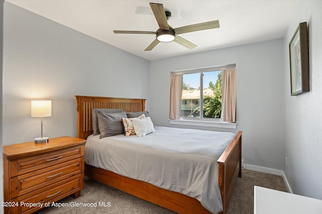 carpeted bedroom with ceiling fan