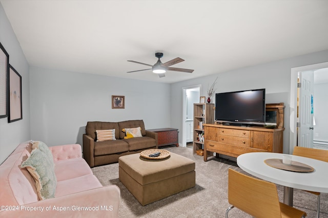 living room featuring light carpet and ceiling fan