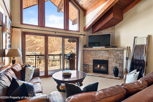 living room with carpet, wood ceiling, beam ceiling, high vaulted ceiling, and a fireplace