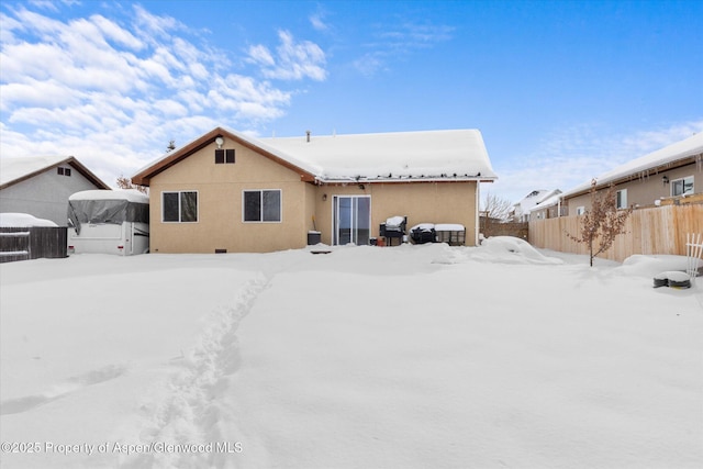 view of snow covered house