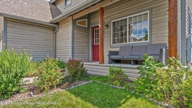 doorway to property featuring covered porch