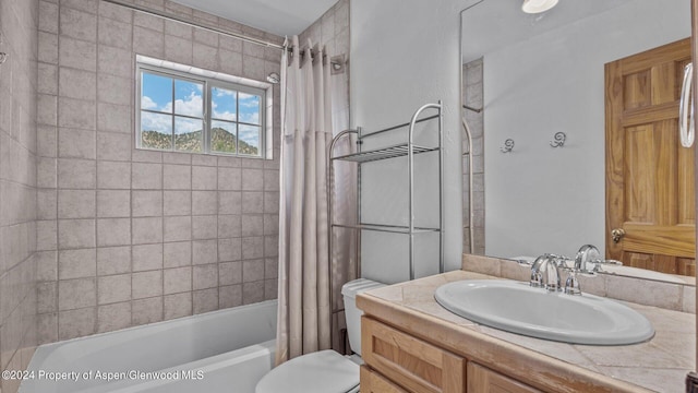 full bathroom featuring shower / bath combo, toilet, and vanity