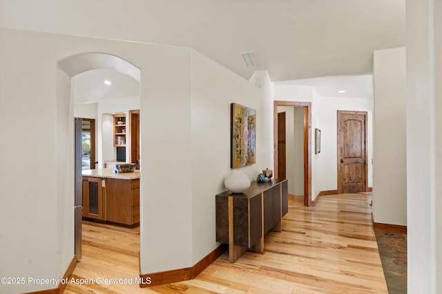 4034 Crystal Bridge Dr, Carbondale, CO 81623 - corridor with light wood-style flooring, recessed lighting, arched walkways, and baseboards