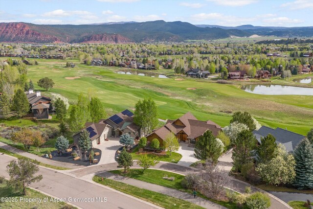 4034 Crystal Bridge Dr, Carbondale, CO 81623 - aerial overview of property's location with a water and mountain view, nearby suburban area, and a local golf course