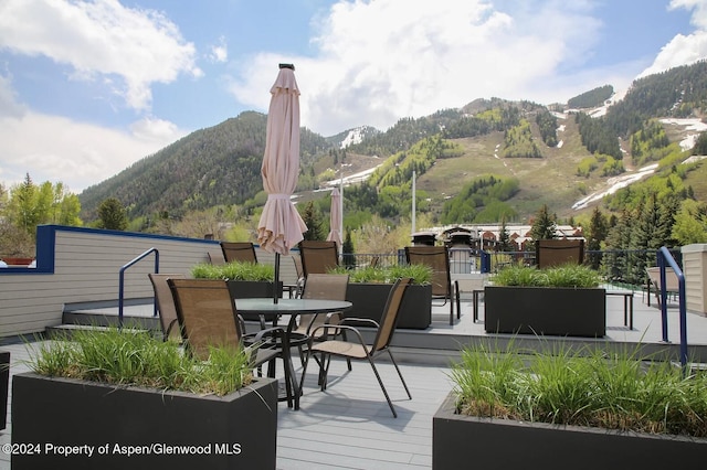 wooden terrace with a mountain view