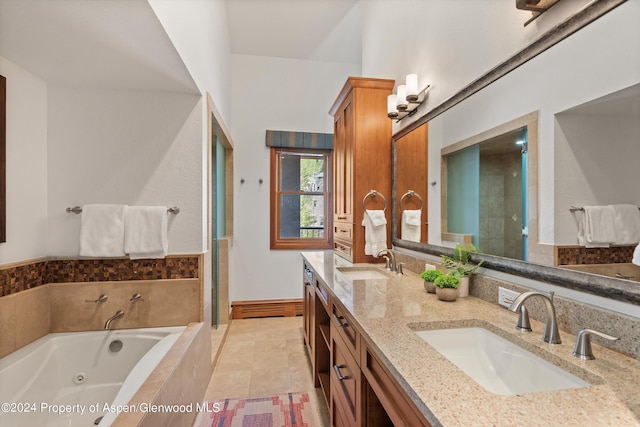 bathroom with tile patterned flooring, shower with separate bathtub, and vanity