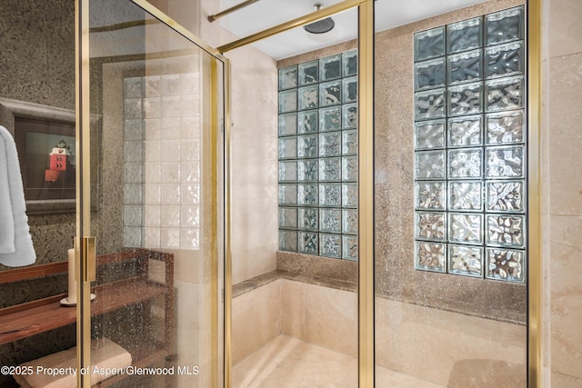 bathroom featuring an enclosed shower