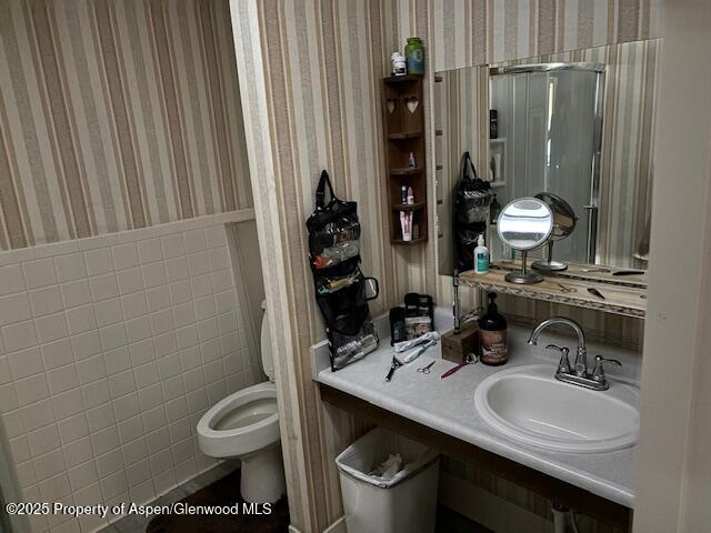 1598 N Yampa Ave, Craig, CO 81625 - bathroom with wallpapered walls and toilet