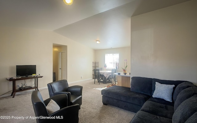 living room with lofted ceiling and light carpet