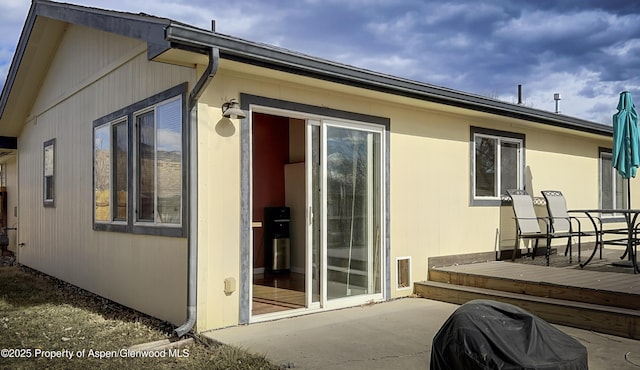 exterior space with a patio and a deck