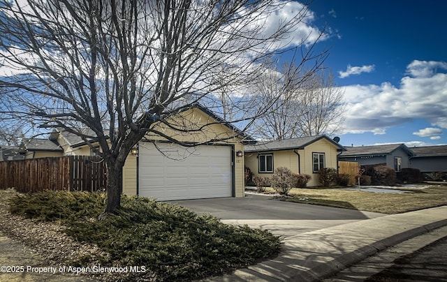 ranch-style house featuring a garage