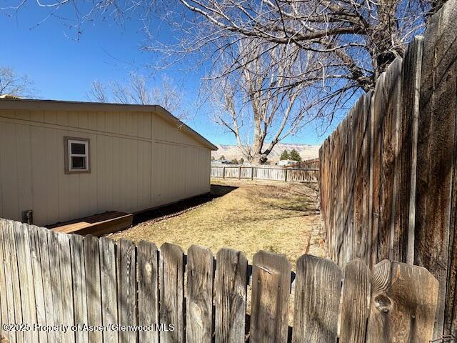 view of yard with a fenced backyard