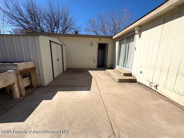 view of patio / terrace featuring an outdoor structure and entry steps