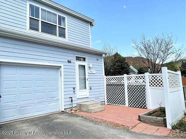 garage with fence