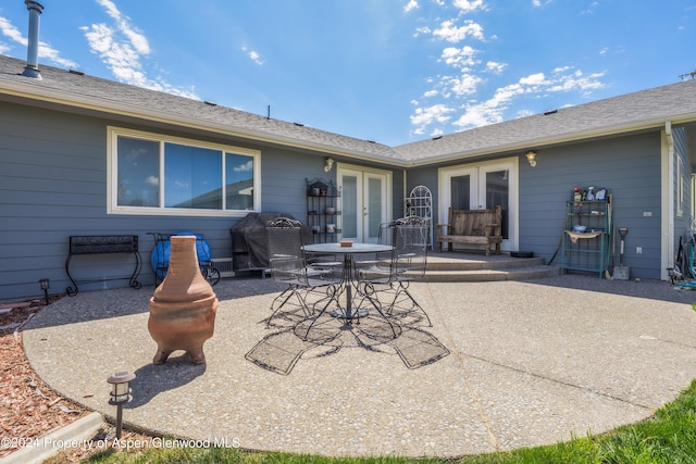 rear view of house featuring french doors and a patio